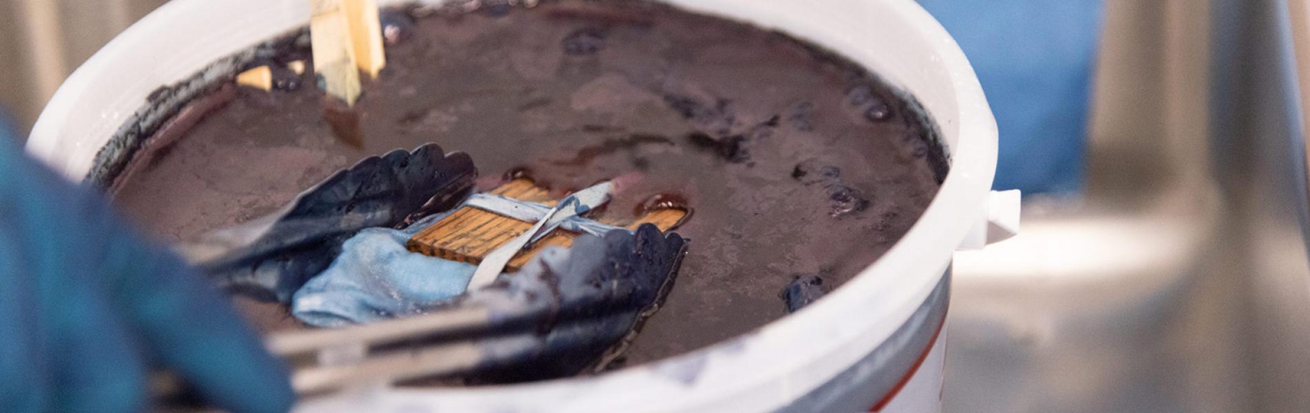 Up-close photo of indigo dye vat