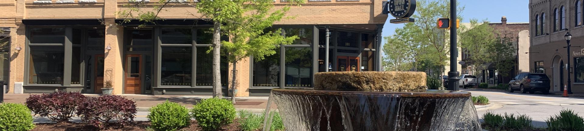 Photo of a fountain in front of the Kress building in Downtown Florence